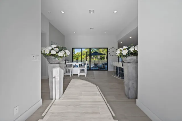 a lobby with furniture and floor to ceiling window