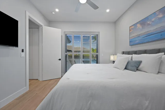 a bathroom with a granite countertop toilet a sink and shower