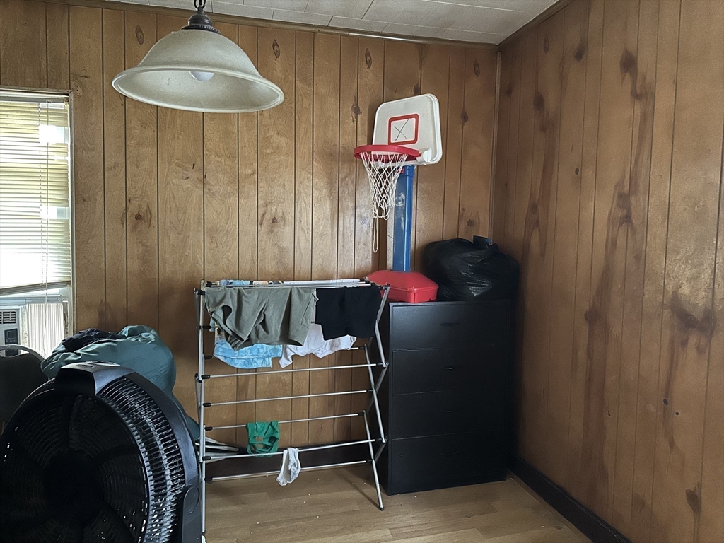 11 Foster Street Fall River, MA 02721 - Photo 11 of 15 a room with a table and a chandelier