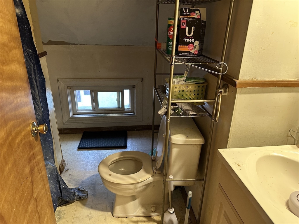 11 Foster Street Fall River, MA 02721 - Photo 14 of 15 a bathroom with a toilet and a sink