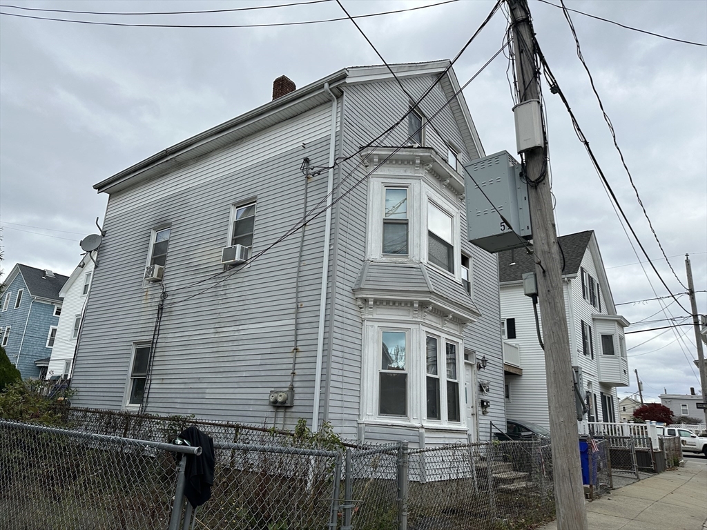 11 Foster Street Fall River, MA 02721 - Photo 2 of 15 a view of a big house with wooden fence