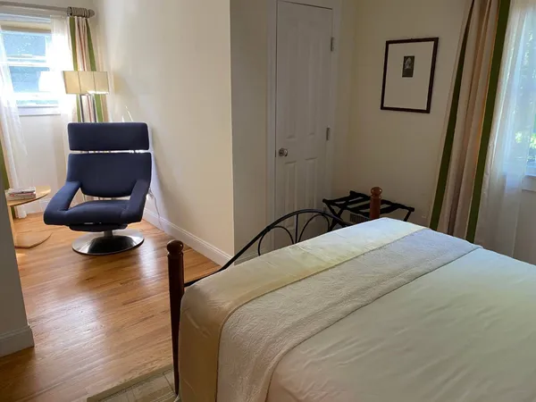 a bedroom with bed and window