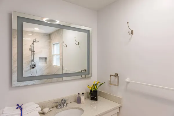 a bathroom with a sink and a mirror