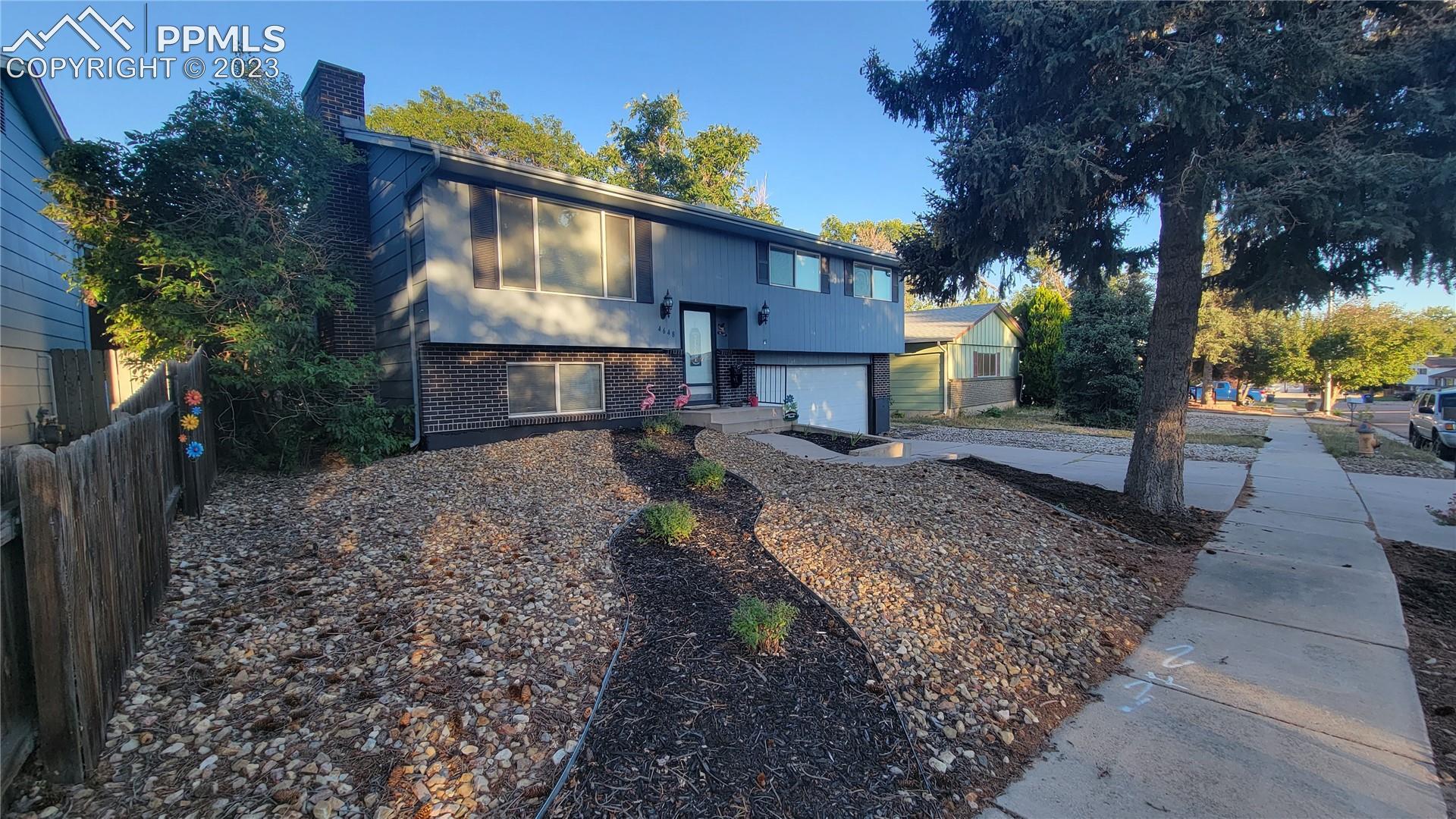 4648 Ridgeglen Road Colorado Springs, CO 80918 - Photo 1 of 19 Charming Bi-Level in Garden Ranch!