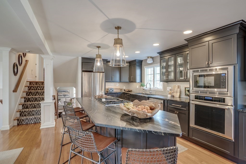 6 Phaeton Circle Andover, MA 01810 - Photo 13 of 42 a kitchen with a table and chairs in it
