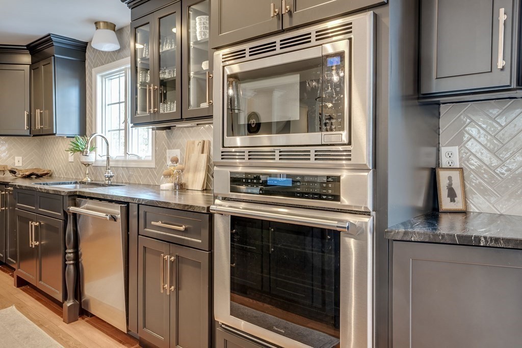 6 Phaeton Circle Andover, MA 01810 - Photo 14 of 42 a kitchen with granite countertop a stove top oven