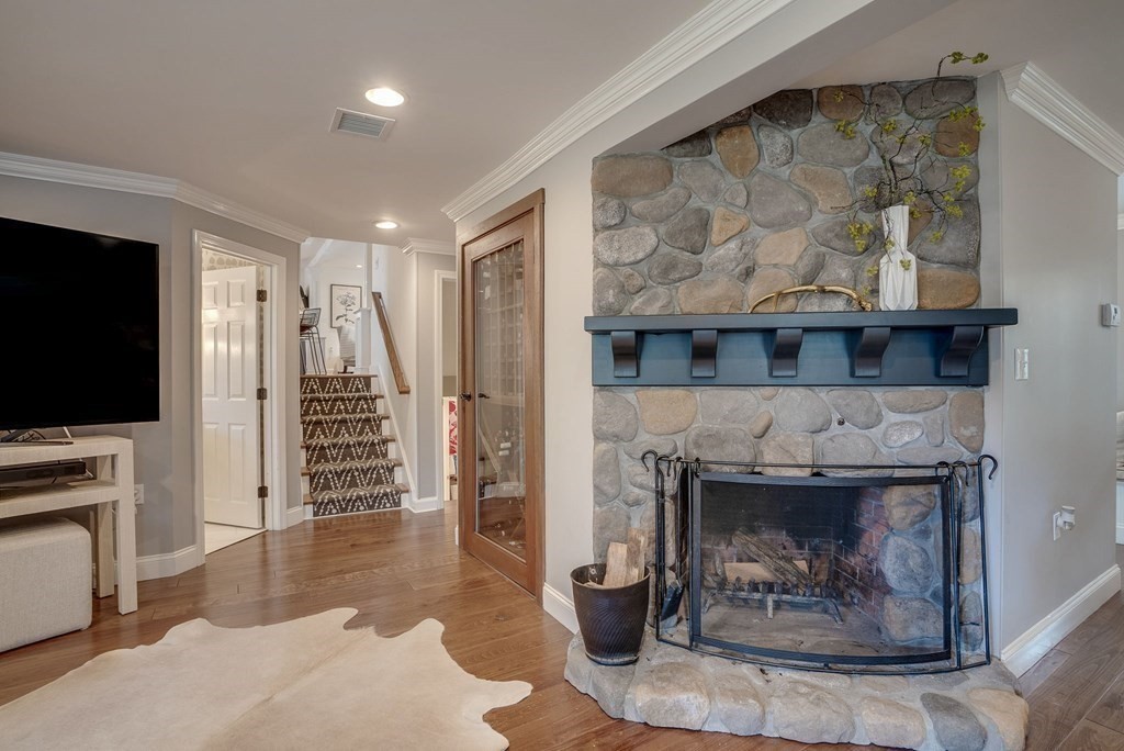 6 Phaeton Circle Andover, MA 01810 - Photo 23 of 42 a living room with furniture and a fireplace
