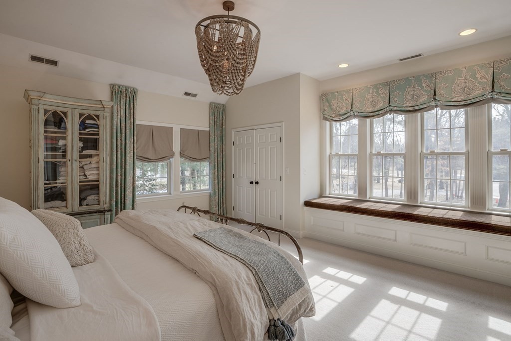 6 Phaeton Circle Andover, MA 01810 - Photo 26 of 42 a spacious bedroom with a large bed and a large window