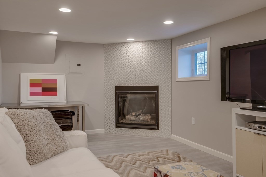 6 Phaeton Circle Andover, MA 01810 - Photo 35 of 42 a hallway with furniture and a flat screen tv