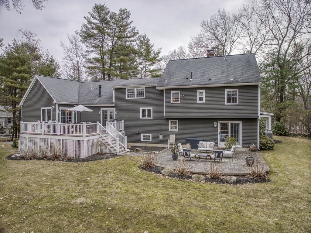 6 Phaeton Circle Andover, MA 01810 - Photo 5 of 42 a front view of a house with a garden and sitting area