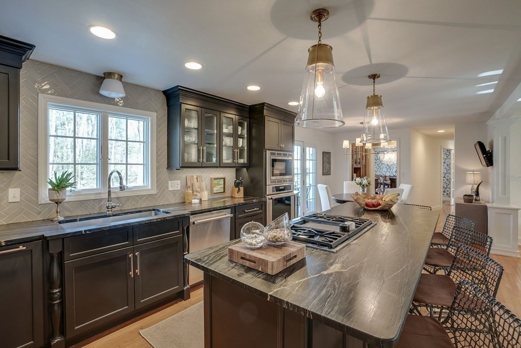 6 Phaeton Circle Andover, MA 01810 - Photo 9 of 42 a kitchen with stainless steel appliances granite countertop a sink stove and refrigerator