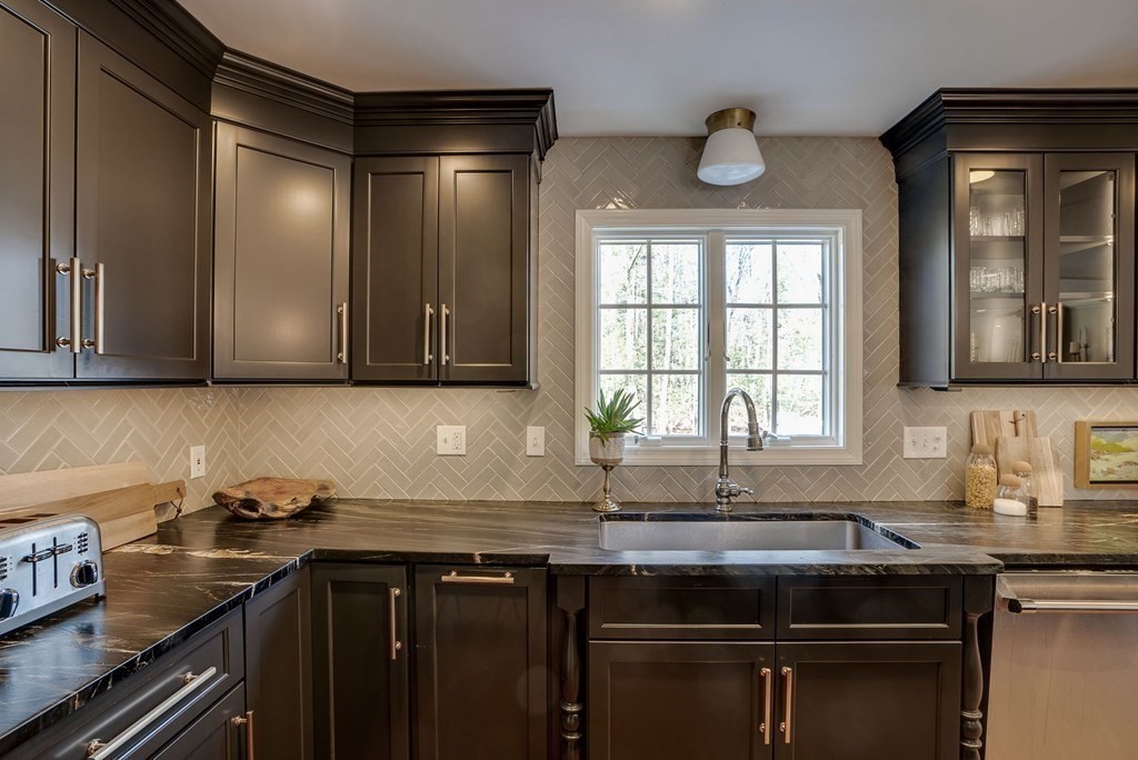 6 Phaeton Circle Andover, MA 01810 - Photo 10 of 42 a kitchen with stainless steel appliances granite countertop a sink stove and cabinets