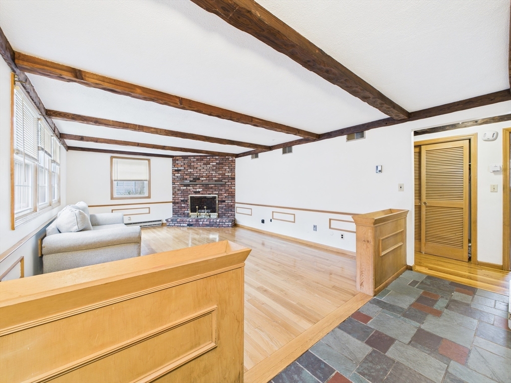 215 Stoney Lea Road Dedham, MA 02026 - Photo 12 of 27 a view of a kitchen with furniture and window