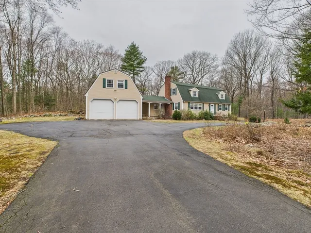 a view of white house with a yard