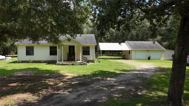 a front view of a house with a yard and porch
