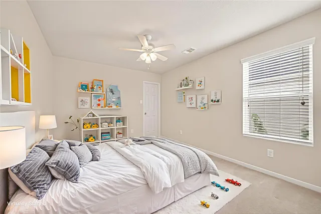 a bedroom with a bed furniture and a window