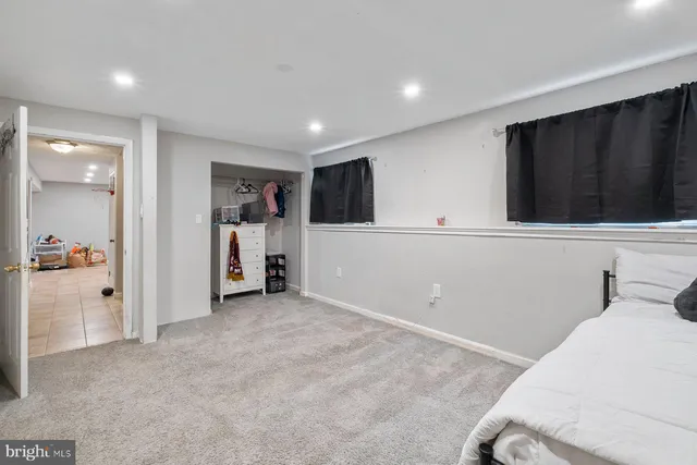 a bathroom with a toilet and a shower curtain