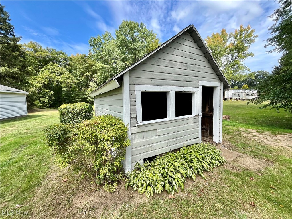 6543 North Ridge Road East Geneva, OH 44041 - Photo 42 of 49 View of outdoor structure featuring a lawn