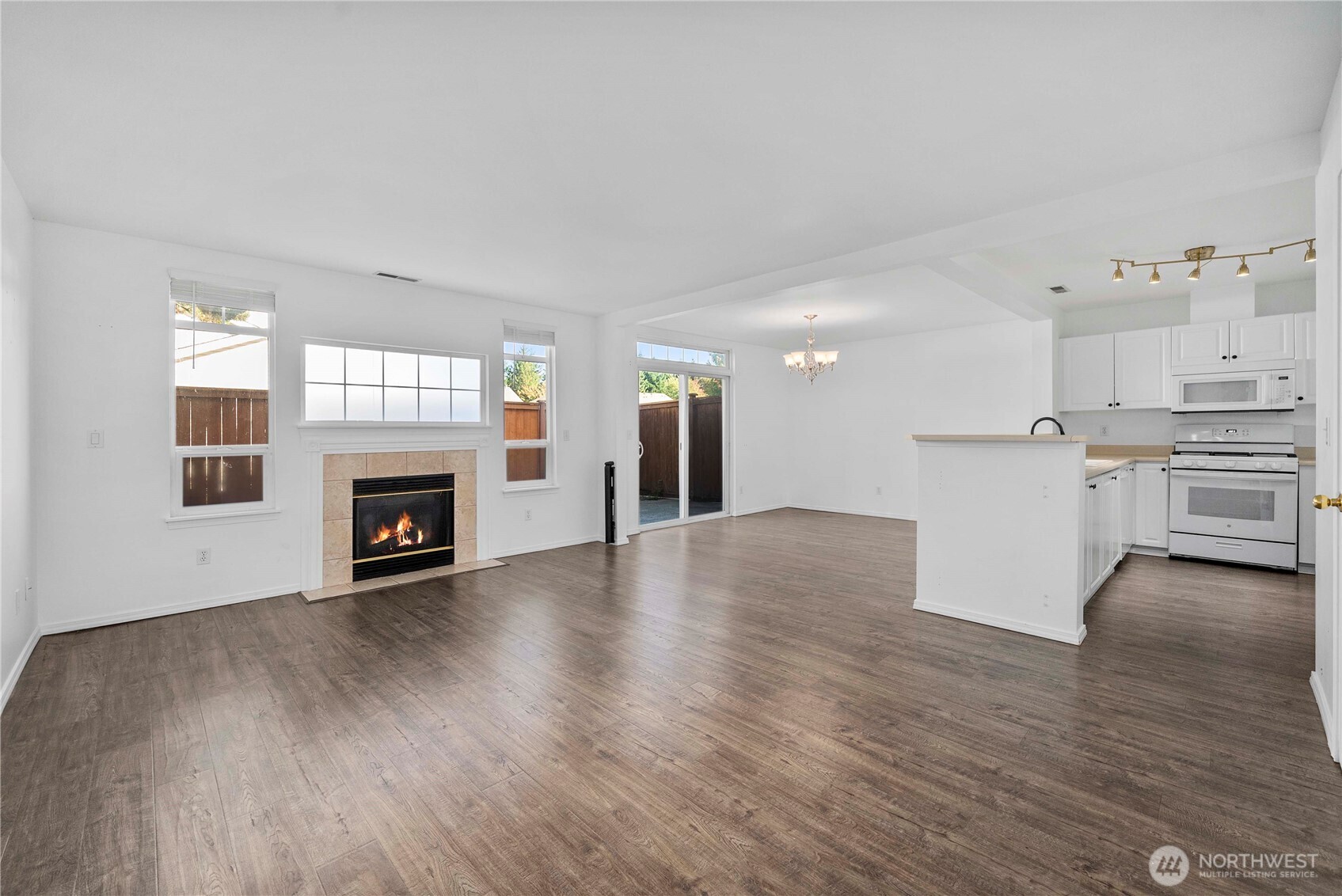 6611 Millstone Lane Southeast, Unit F101 Lacey, WA 98513 - Photo 11 of 40 a view of kitchen with furniture and wooden floor
