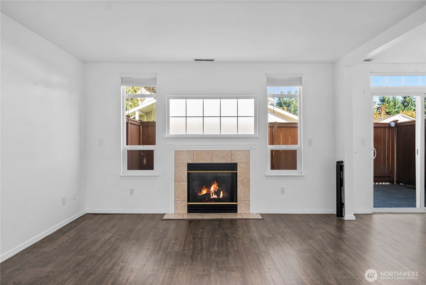 6611 Millstone Lane Southeast, Unit F101 Lacey, WA 98513 - Photo 12 of 40 an empty room with windows and fireplace