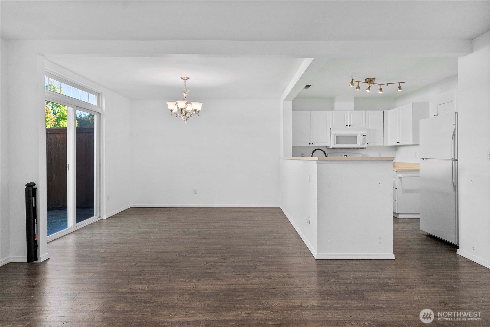 6611 Millstone Lane Southeast, Unit F101 Lacey, WA 98513 - Photo 13 of 40 a view of a kitchen with wooden floor