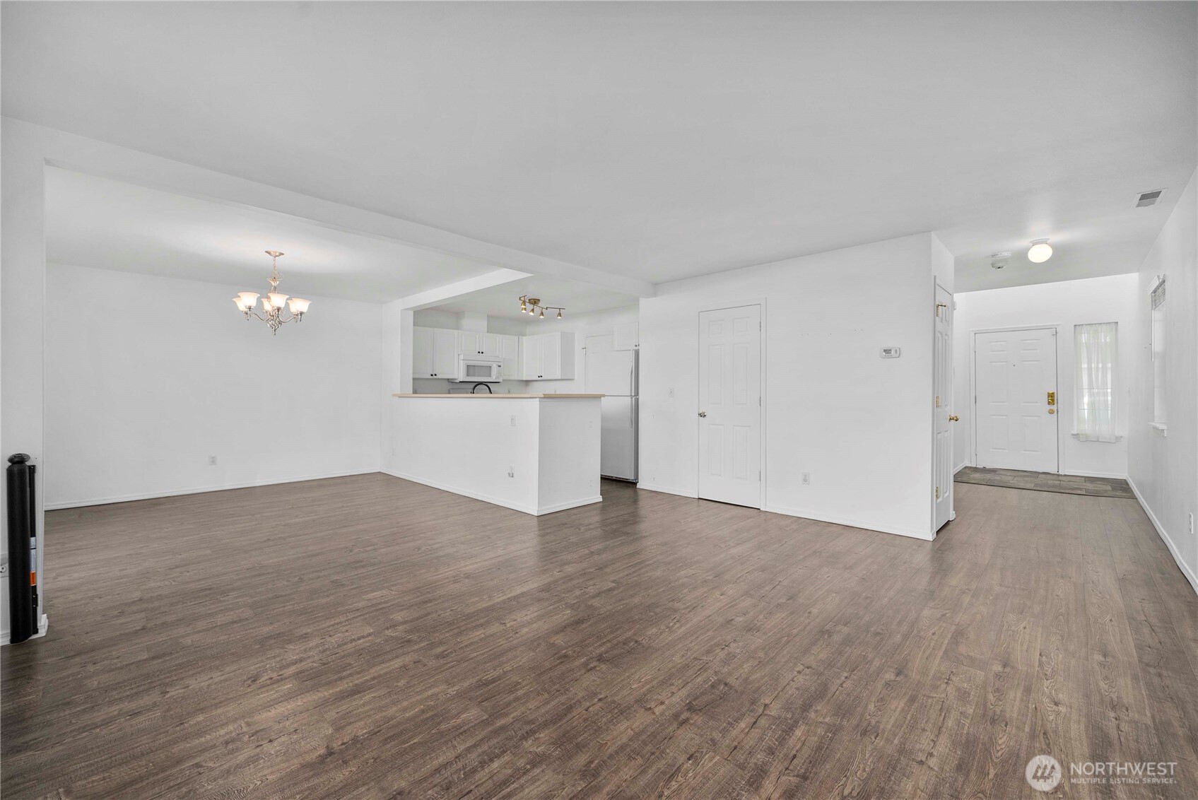 6611 Millstone Lane Southeast, Unit F101 Lacey, WA 98513 - Photo 14 of 40 a view of a kitchen with a sink and a refrigerator