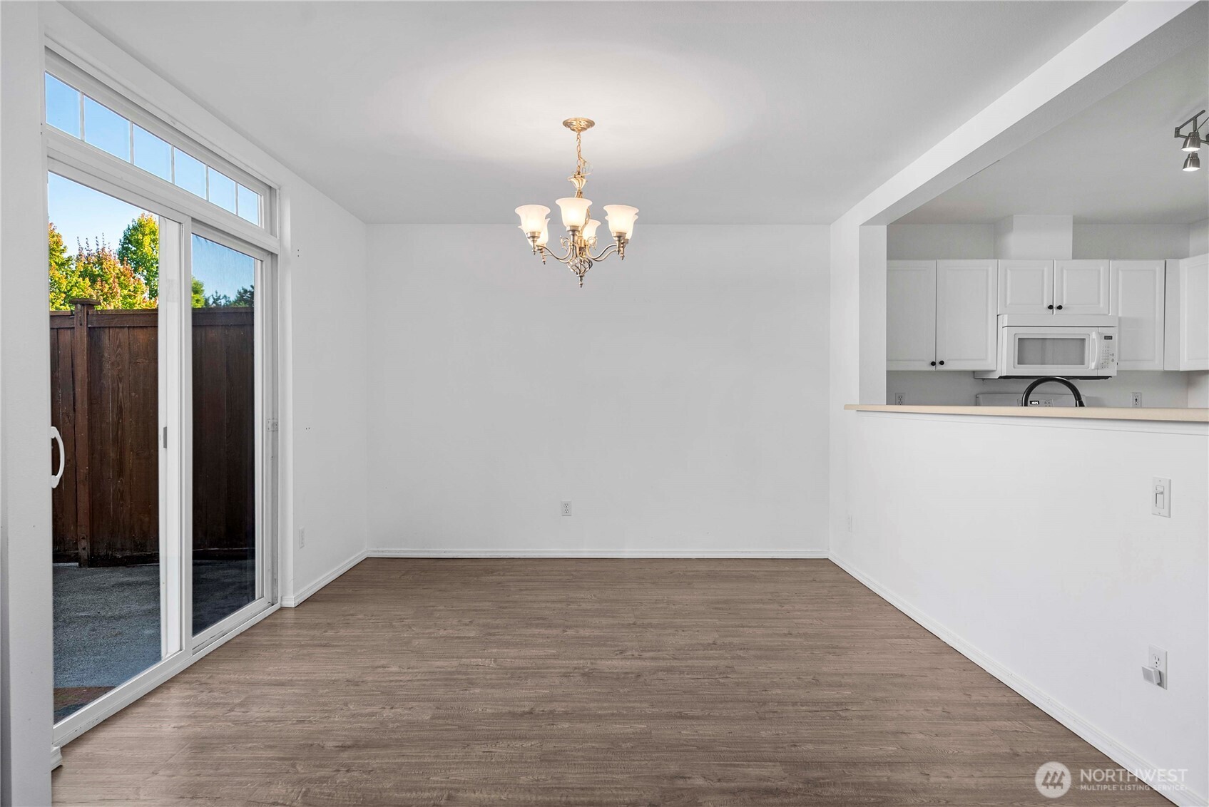 6611 Millstone Lane Southeast, Unit F101 Lacey, WA 98513 - Photo 15 of 40 wooden floor in an empty room with a window