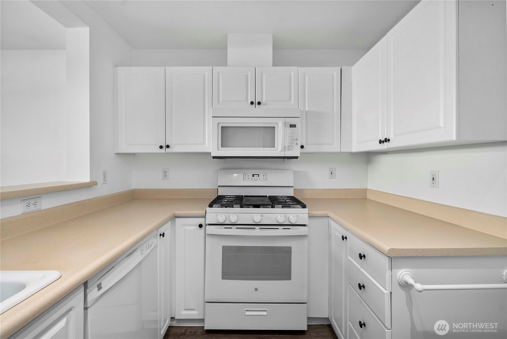 6611 Millstone Lane Southeast, Unit F101 Lacey, WA 98513 - Photo 21 of 40 a kitchen with white cabinets and appliances