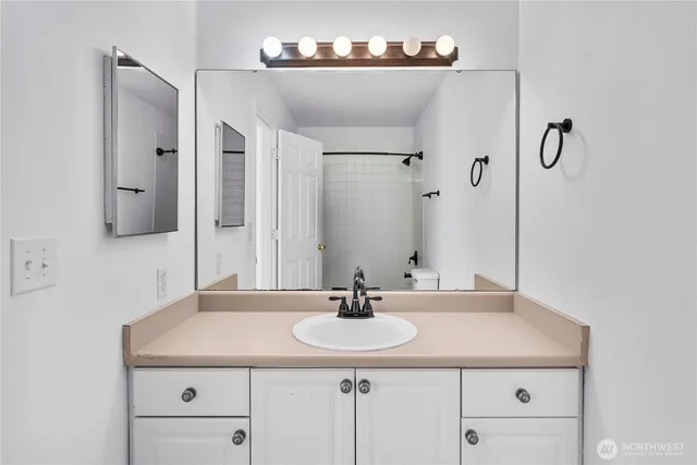 a bathroom with a shower and a bath tub
