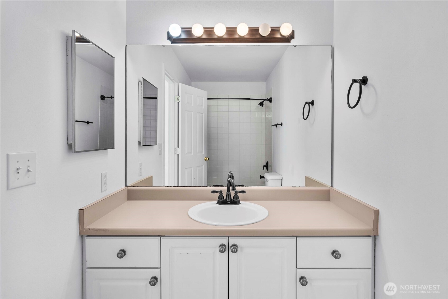 6611 Millstone Lane Southeast, Unit F101 Lacey, WA 98513 - Photo 30 of 40 a bathroom with a sink and a mirror