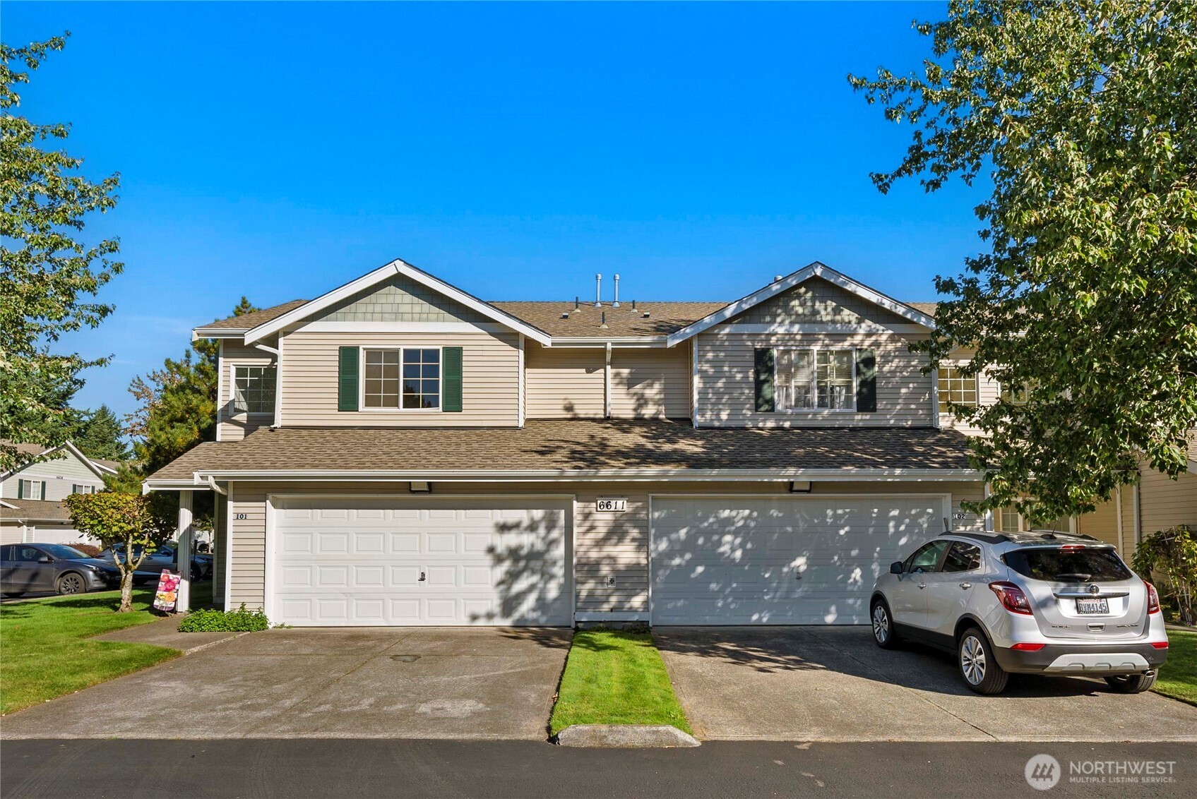 6611 Millstone Lane Southeast, Unit F101 Lacey, WA 98513 - Photo 4 of 40 a car parked in front of a house
