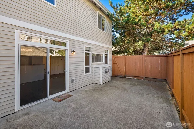 a view of a house with wooden fence