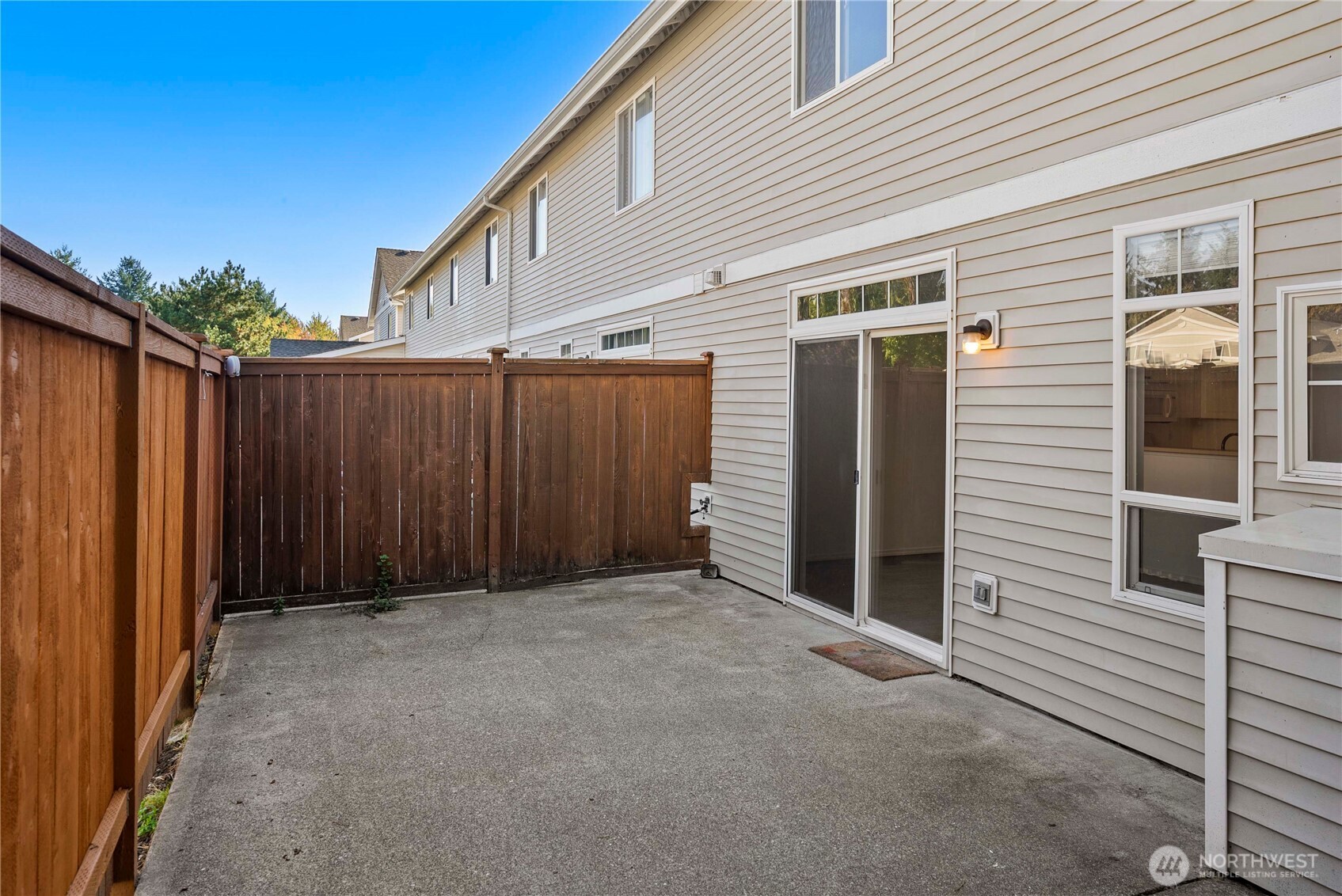 6611 Millstone Lane Southeast, Unit F101 Lacey, WA 98513 - Photo 9 of 40 a view of a house with wooden fence