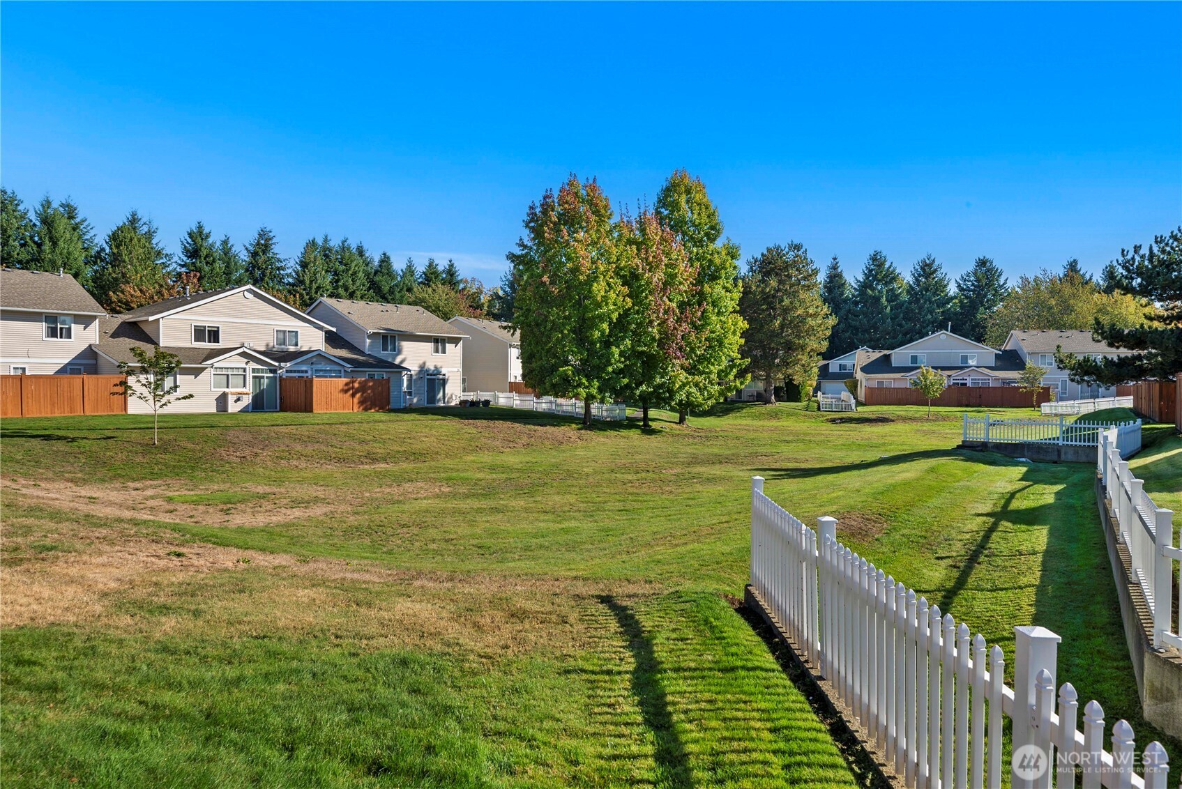 6611 Millstone Lane Southeast, Unit F101 Lacey, WA 98513 - Photo 10 of 40 a view of a lake with houses