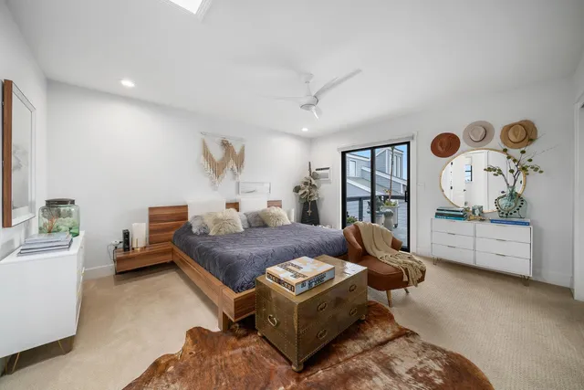 a living room with furniture window and wall painting