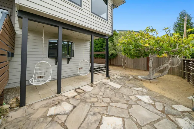a view of a chairs and table in the patio