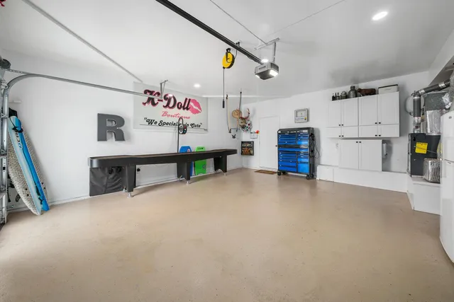 a view of an empty room with furniture and a flat screen tv