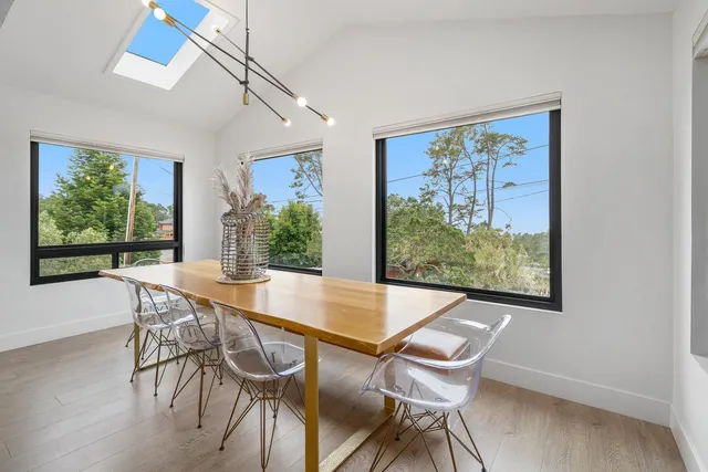 a view of a dining room with furniture window and outside view