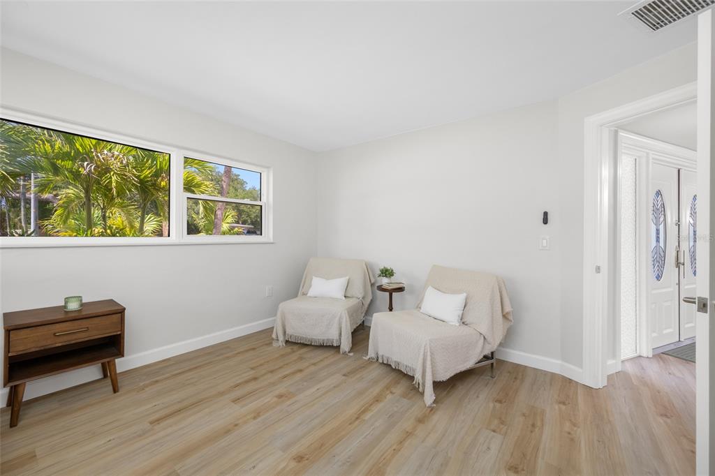 656 Mehlenbacher Road Belleair, FL 33756 - Photo 28 of 49 a room with two beds and a potted plant