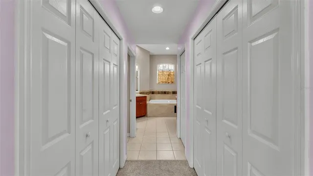 a kitchen with granite countertop cabinets stainless steel appliances and a window
