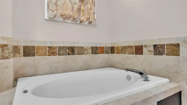 a bathroom with a sink shower and a mirror