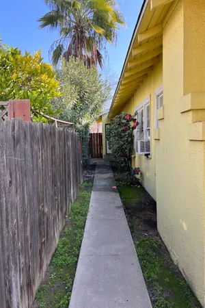 a view of a pathway with a house