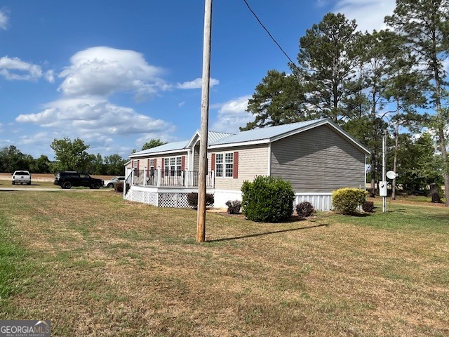 4338 Union Road Metter, GA 30439 - Photo 2 of 26 a view of a house with backyard and trees