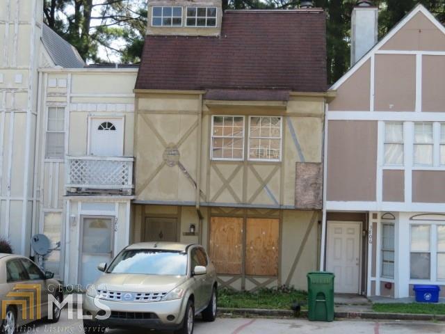 3808 London Drive Decatur, GA 30032 - Photo 1 of 1 a front view of a house with a garden and parking