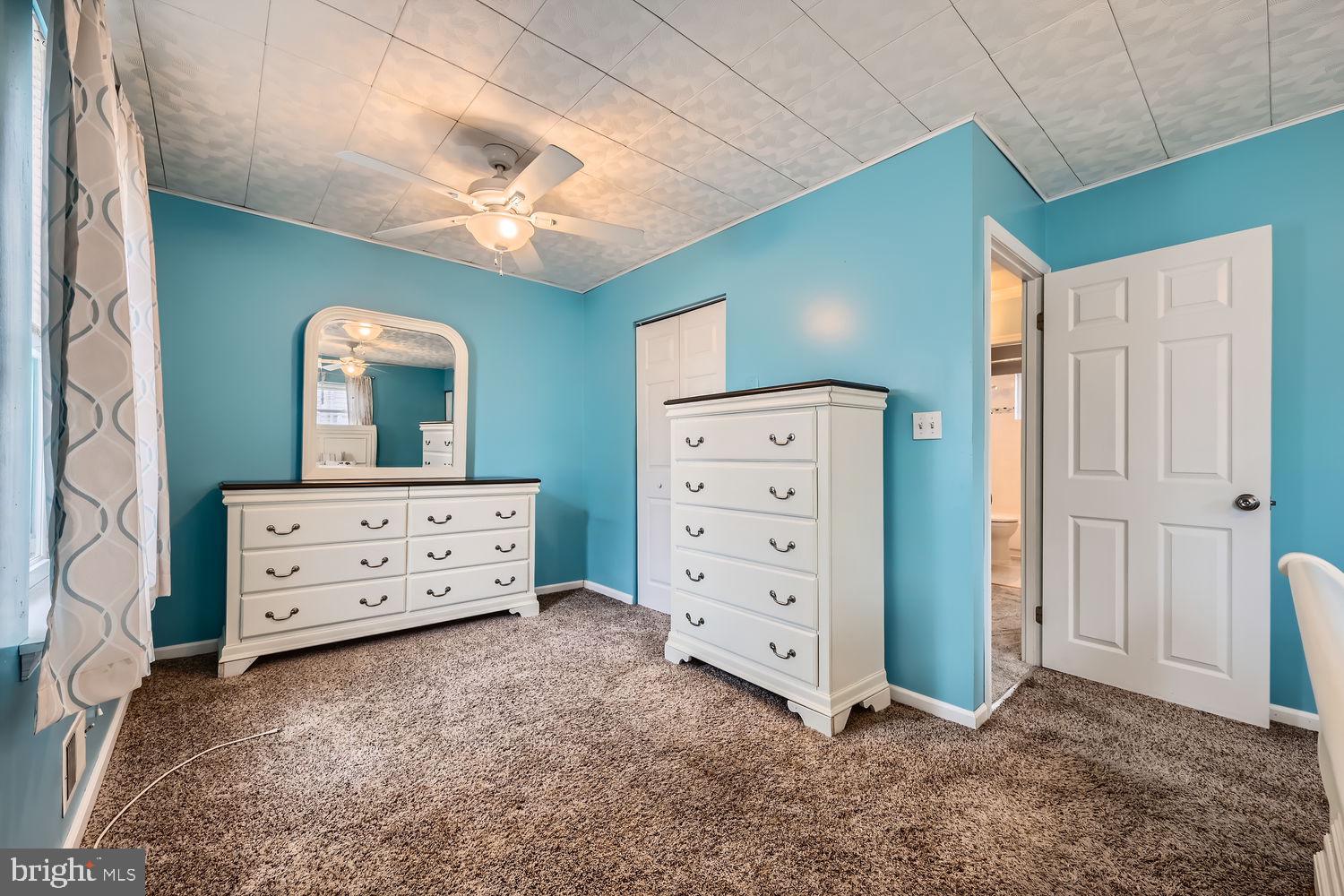 407 Brownell Road Middle River, MD 21220 - Photo 12 of 28 an empty room with cabinet and a dresser
