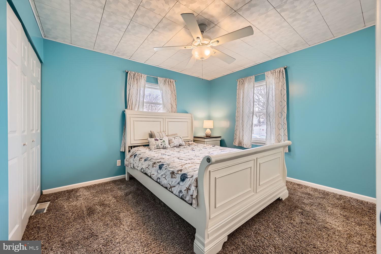 407 Brownell Road Middle River, MD 21220 - Photo 14 of 28 a bedroom with a bed and a chandelier