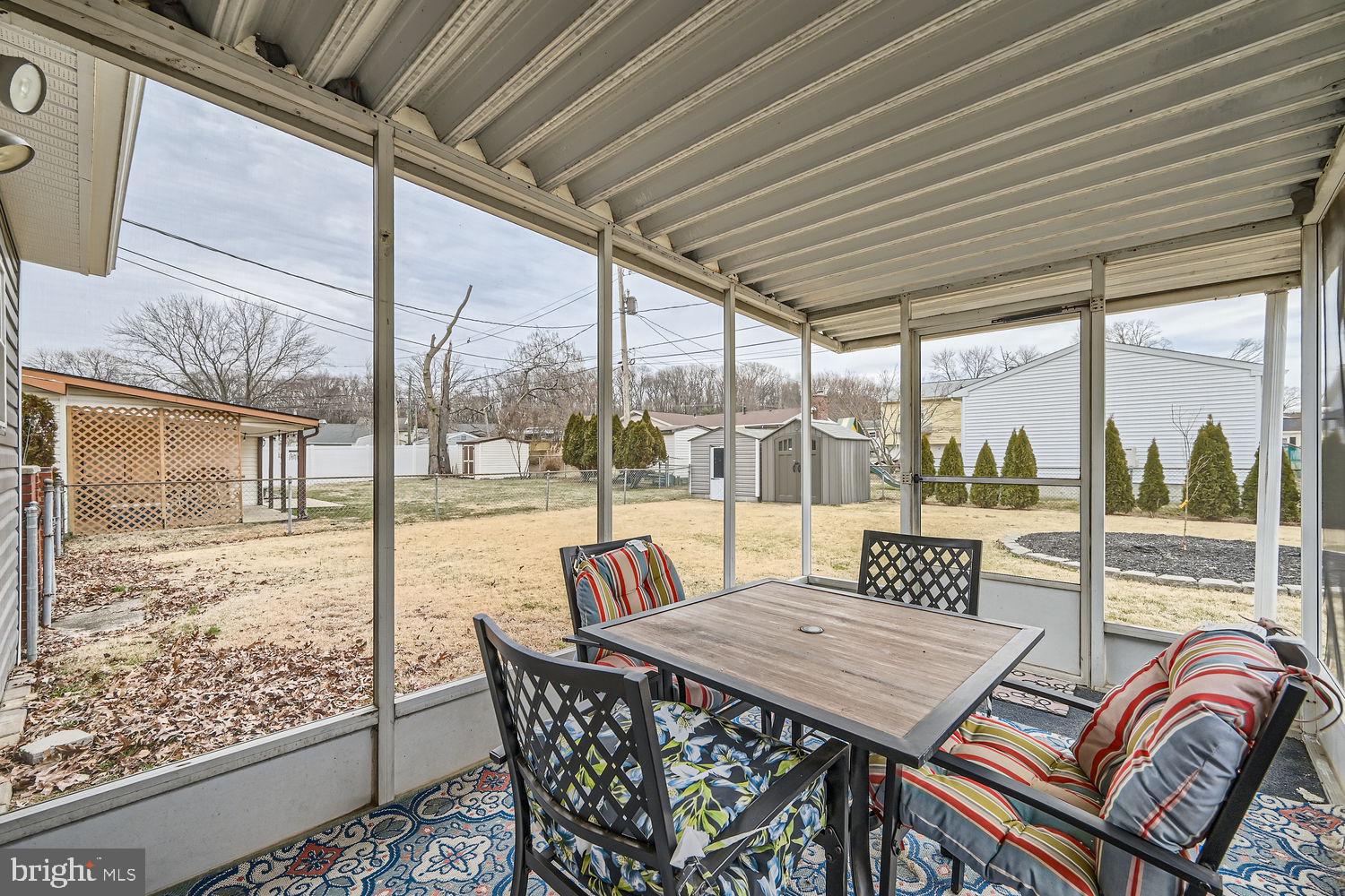 407 Brownell Road Middle River, MD 21220 - Photo 24 of 28 a view of a patio with a table chairs and glass door