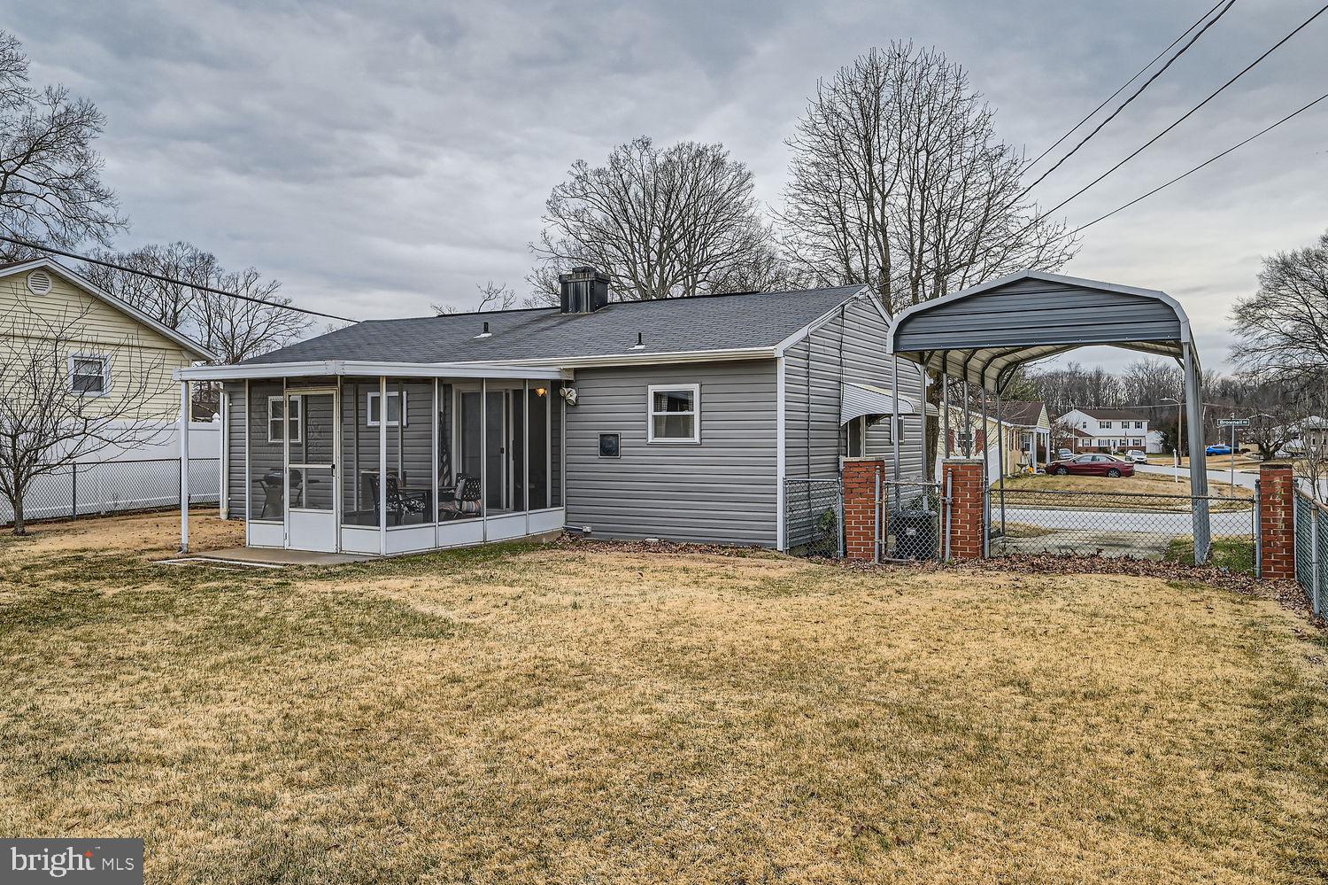 407 Brownell Road Middle River, MD 21220 - Photo 27 of 28 a view of a house with large tree and wooden fence