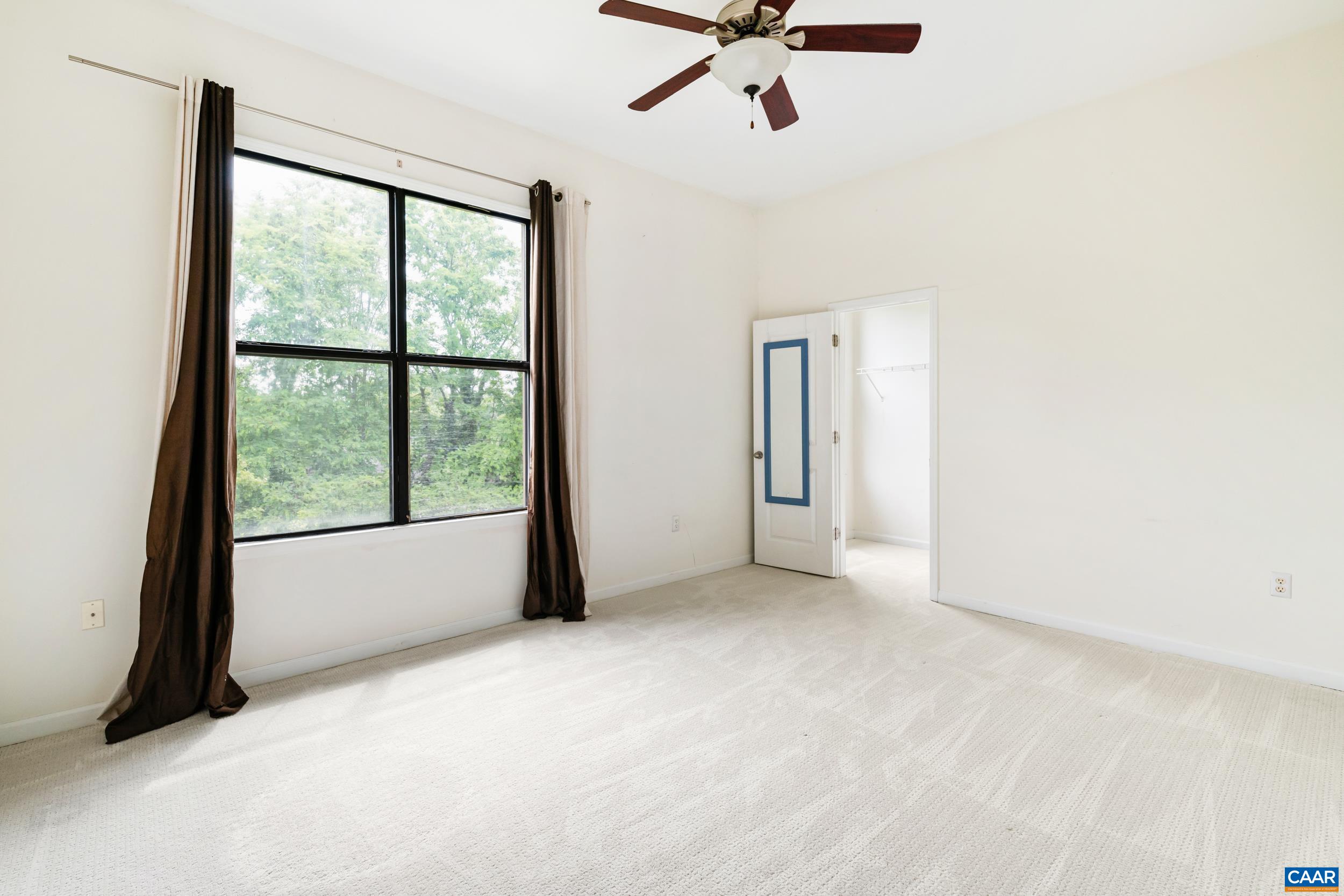760 Walker Square, Unit 4B Charlottesville, VA 22903 - Photo 16 of 40 a view of an empty room with a window