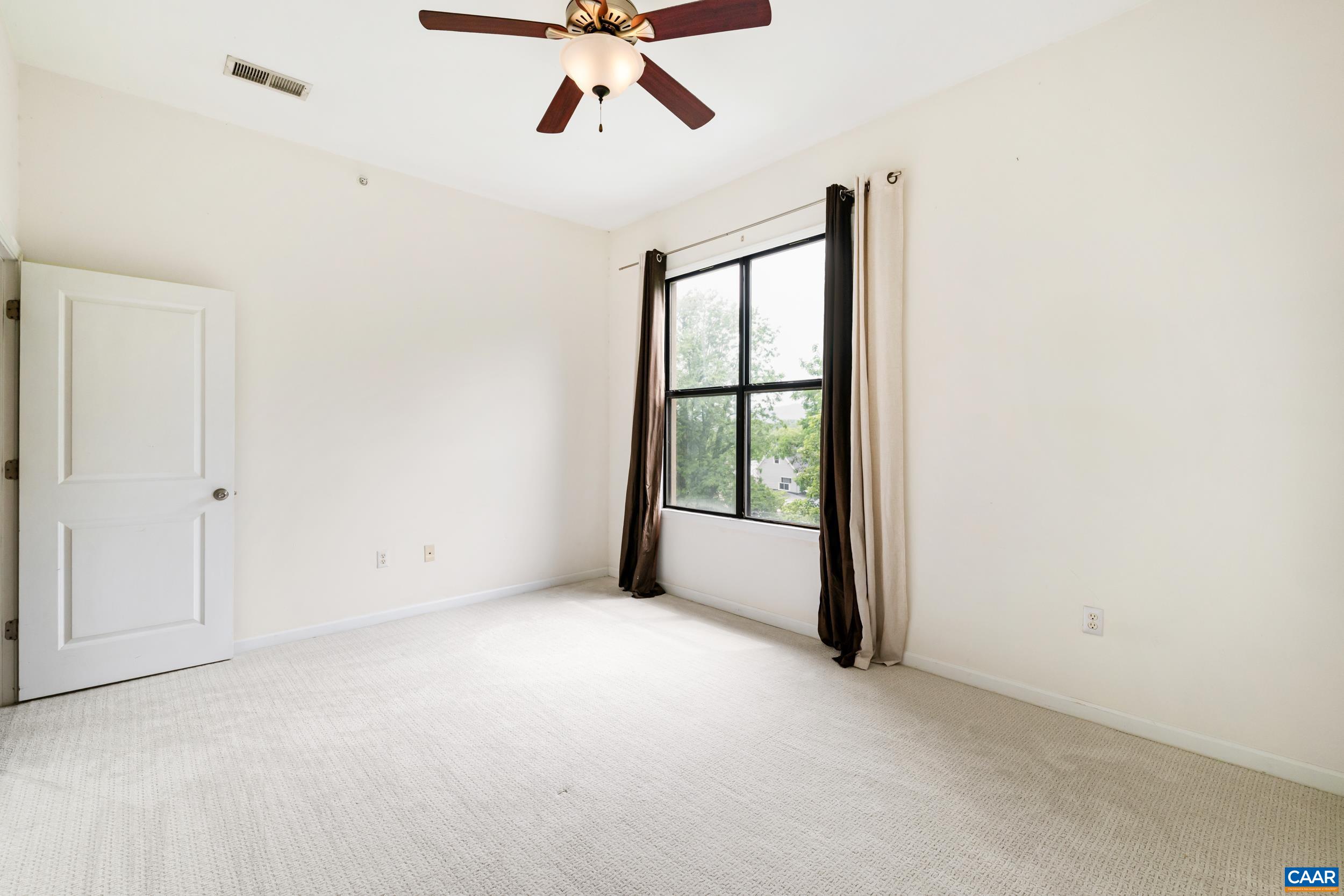 760 Walker Square, Unit 4B Charlottesville, VA 22903 - Photo 18 of 40 an empty room with a window